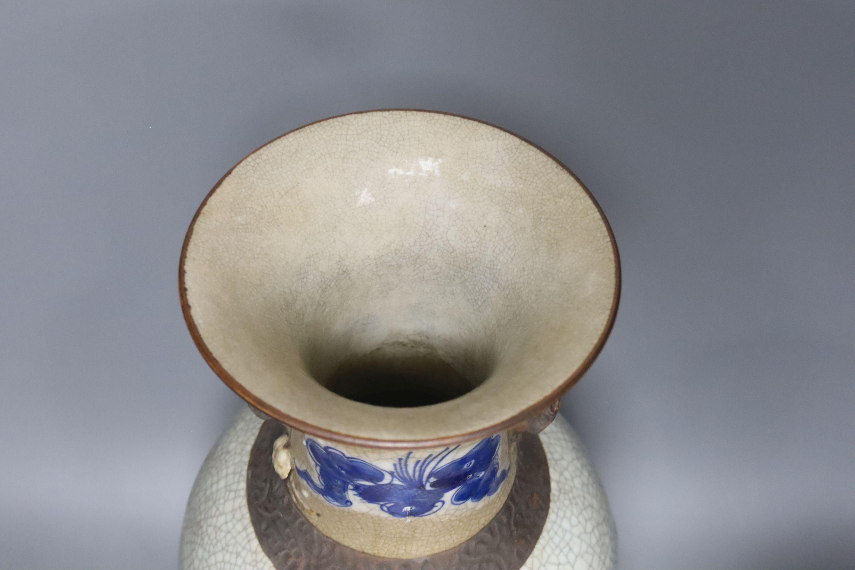 A Chinese blue and white crackle glaze vase, a similar cloisonne vase and a bronze vase, tallest 38cm